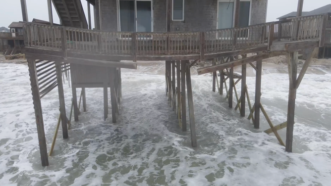 The sagging porch of one abandoned beach home on Buxton's shores.